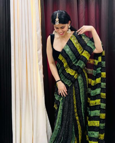 Black and green sequin saree